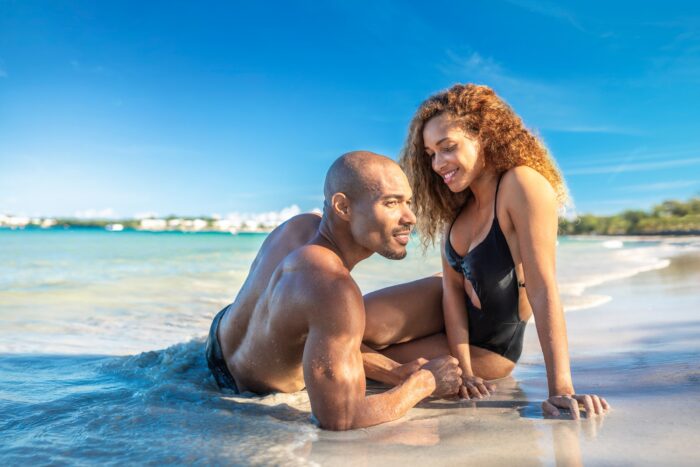 Couple enjoying a romantic beach photoshoot in Montego Bay Jamaica