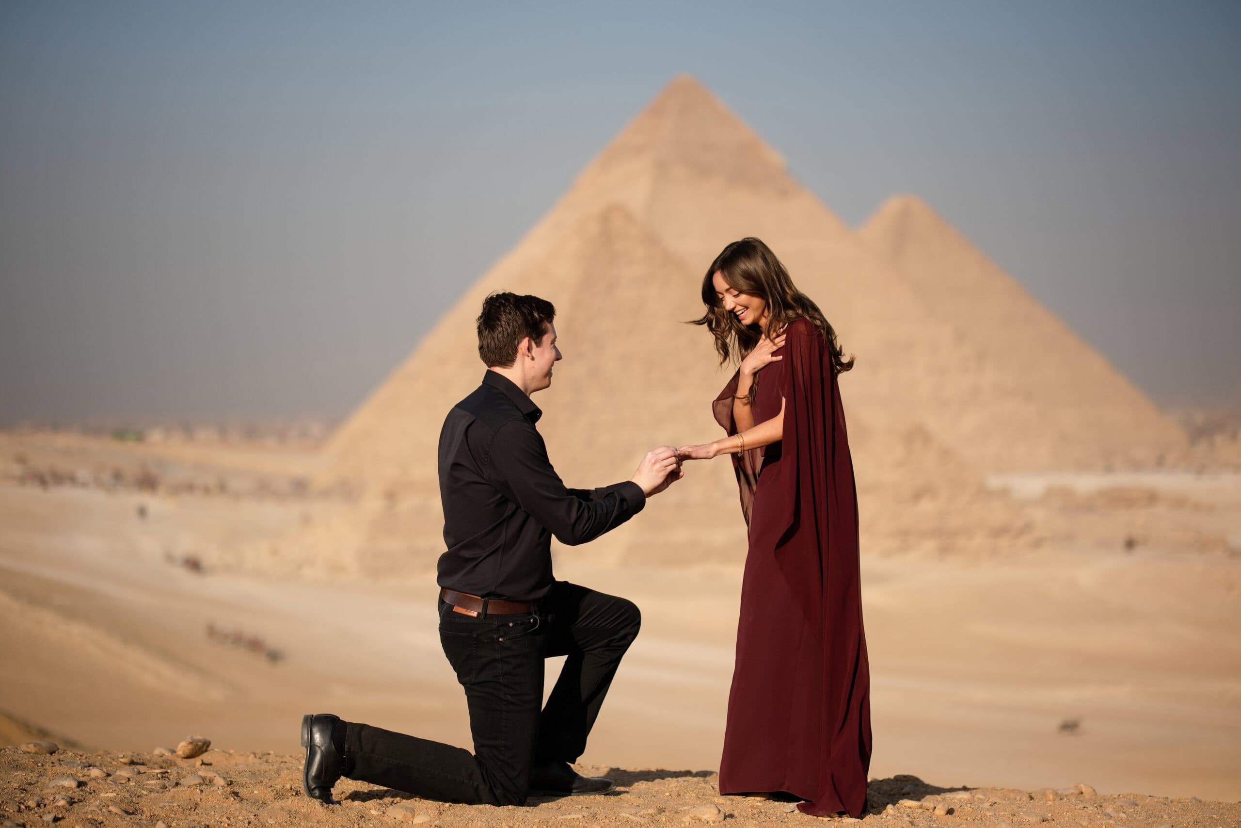 Surprise proposal in front of the pyramids in Egypt